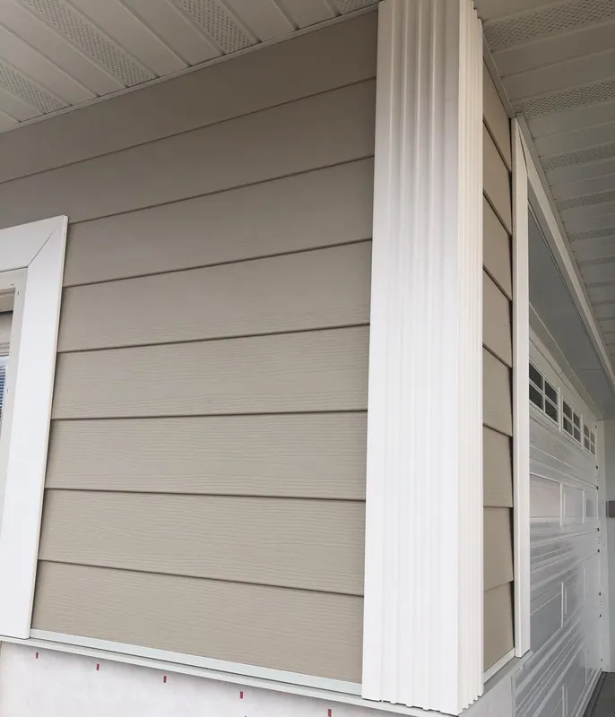 Dark blue board and batten siding with stone accent on Colorado home